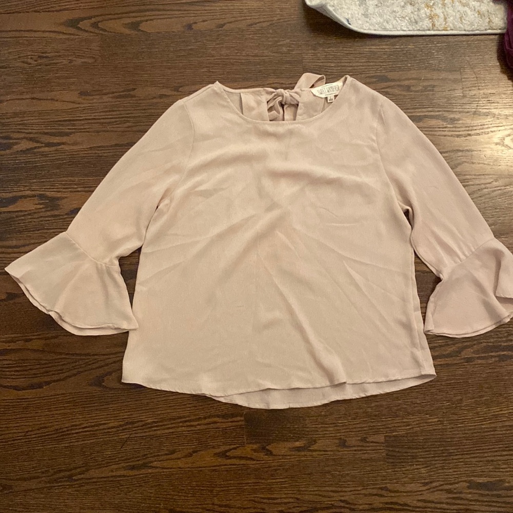 Tan, bell sleeved blouse, with open back tie detail. Size large